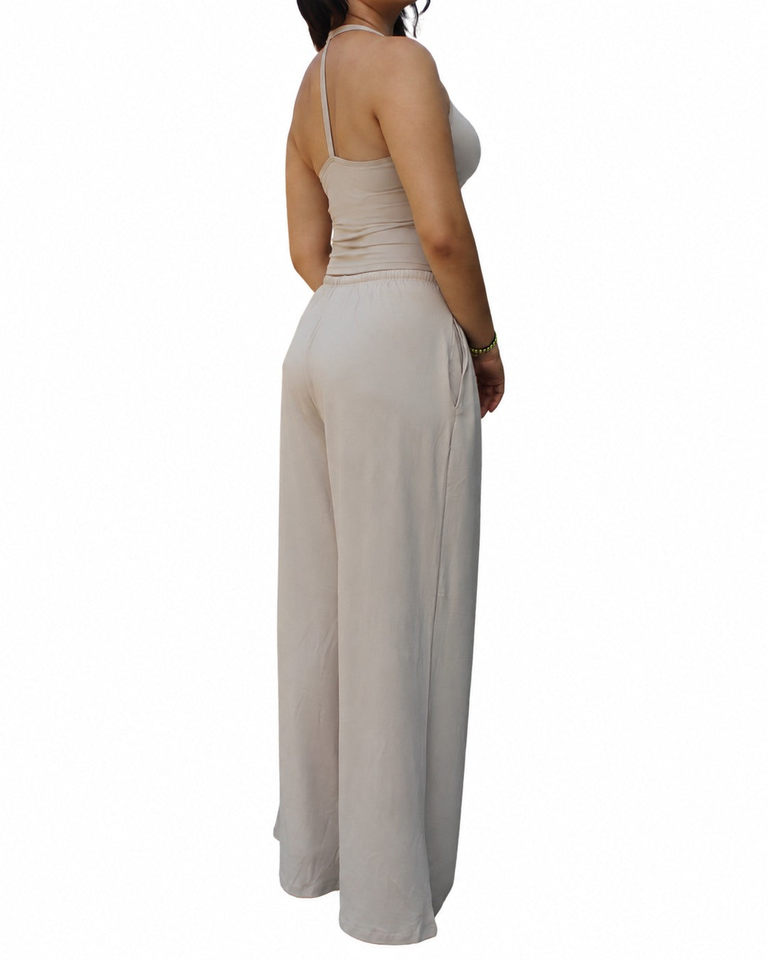 PalkiMarketPlace beige sleeveless crop top and matching wide-leg pants set worn by a woman, side view